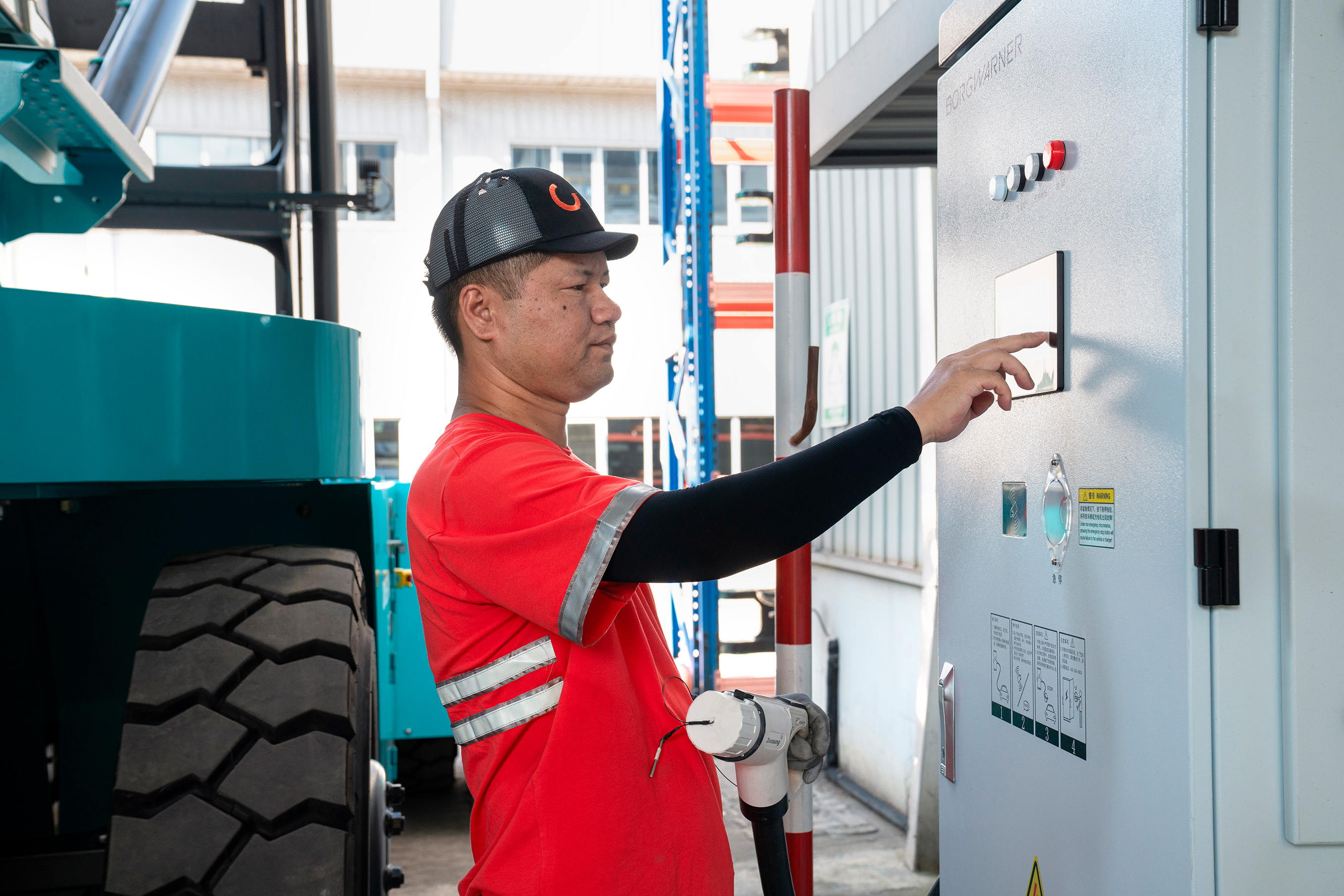 Man charging an electric truck