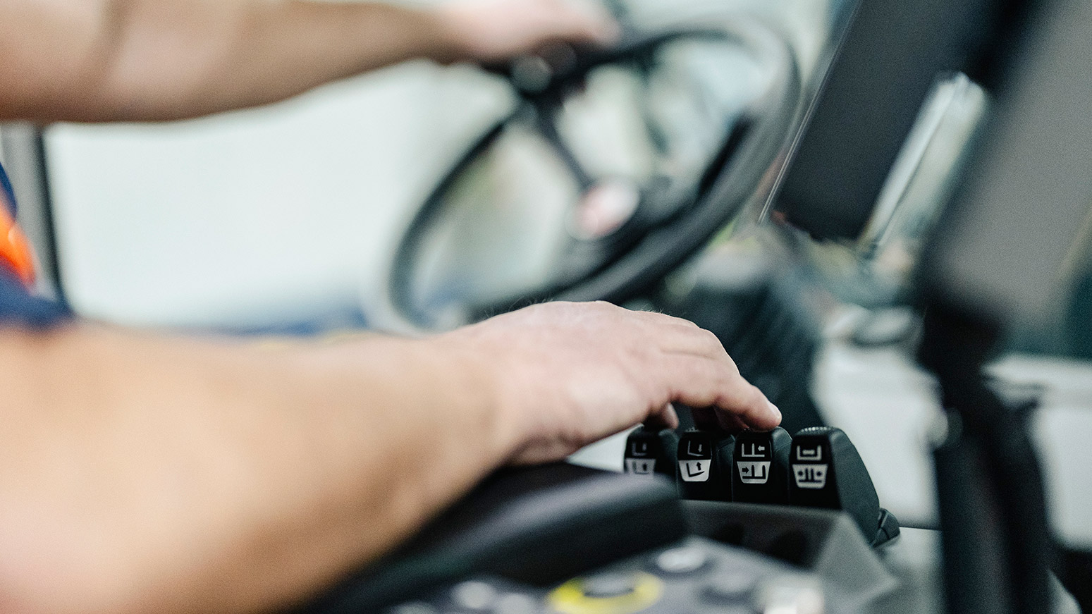 Hands on wheel and ergonomic controls in Konecranes forklift