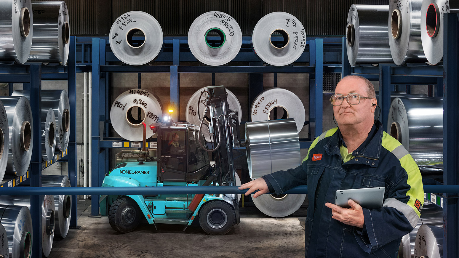 man with tablet and connected forklift